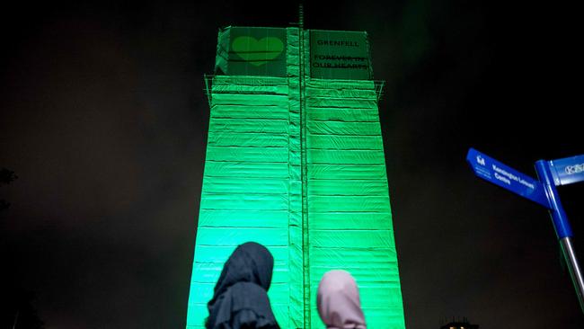 Members of the public hold a vigil and commemoration near Grenfell Tower in west London to honour the people who died during the fire.