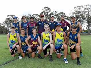 INSPIRED GROUP: (back) Owen Collins, Ben Wood, Brisbane Lions assistant coach Dale Tapping, Lion Mitch Robinson, Brisbane player Corey Lyons, Lions player Charlie Cameron, Trent Burchard, (front) Harry Hodgson, Harry Schneider, Max Harlacz, Zak Mercieca, Mason Gates and Will Zahn enjoy the Shalom College clinic on Monday. Picture: Shane Jones