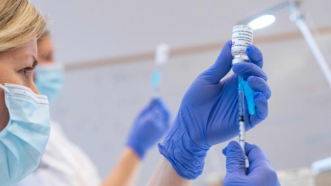 Syringes are loaded with the AstraZeneca Covid-19 Vaccine at the Skane University Hospital vaccination centre in Malmo, Sweden, on February 17, 2021. (Photo by Johan NILSSON / TT NEWS AGENCY / AFP) / Sweden OUT