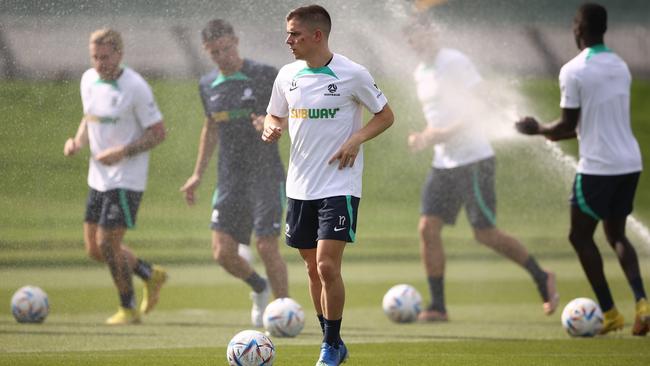 Cam Devlin controls the ball during a Socceroos training session in Doha. His father Andrew has pulled back the green and gold curtain in Qatar. Picture: Getty Images