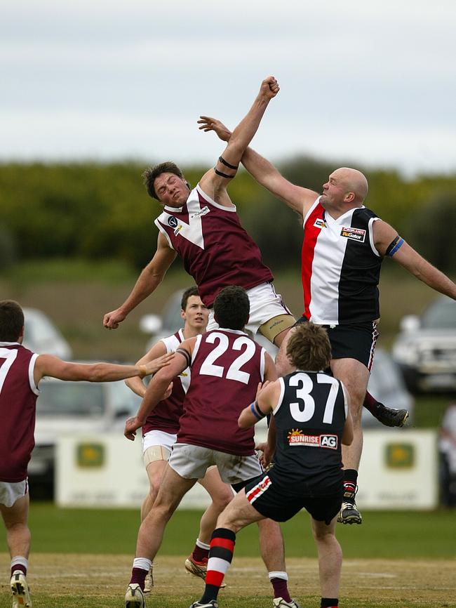 Callan Beasy, left, competes in the ruck for Swan Hill against Tooleybuc-Manangatang.