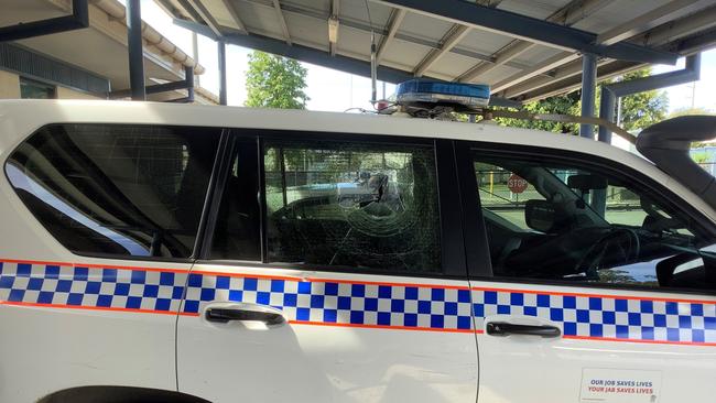 A 22-year-old Garbutt man has been charged after he allegedly threw rocks at a police vehicle.