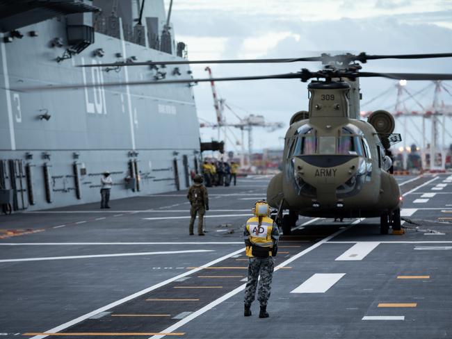 The HMAS Adelaide embarks Australian Army CH-47 Chinook Heavy-Lift Helicopters before departing the Port of Brisbane, to provide humanitarian assistance to the Government of Tonga. Picture: Australian Defence Force