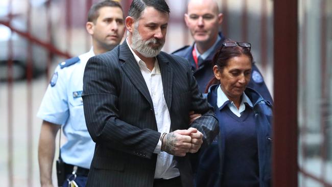 Karl Michael Hague is escorted from a prison van into the Supreme Court of Victoria in Melbourne, Friday, June 15, 2018. Picture: AAP Image/David Crosling