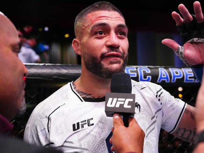 LAS VEGAS, NEVADA - MARCH 02: Tyson Pedro of Australia announces his retirement after a loss against Vitor Petrino of Brazil in a light heavyweight bout during the UFC Fight Night event at UFC APEX on March 02, 2024 in Las Vegas, Nevada. (Photo by Jeff Bottari/Zuffa LLC via Getty Images)