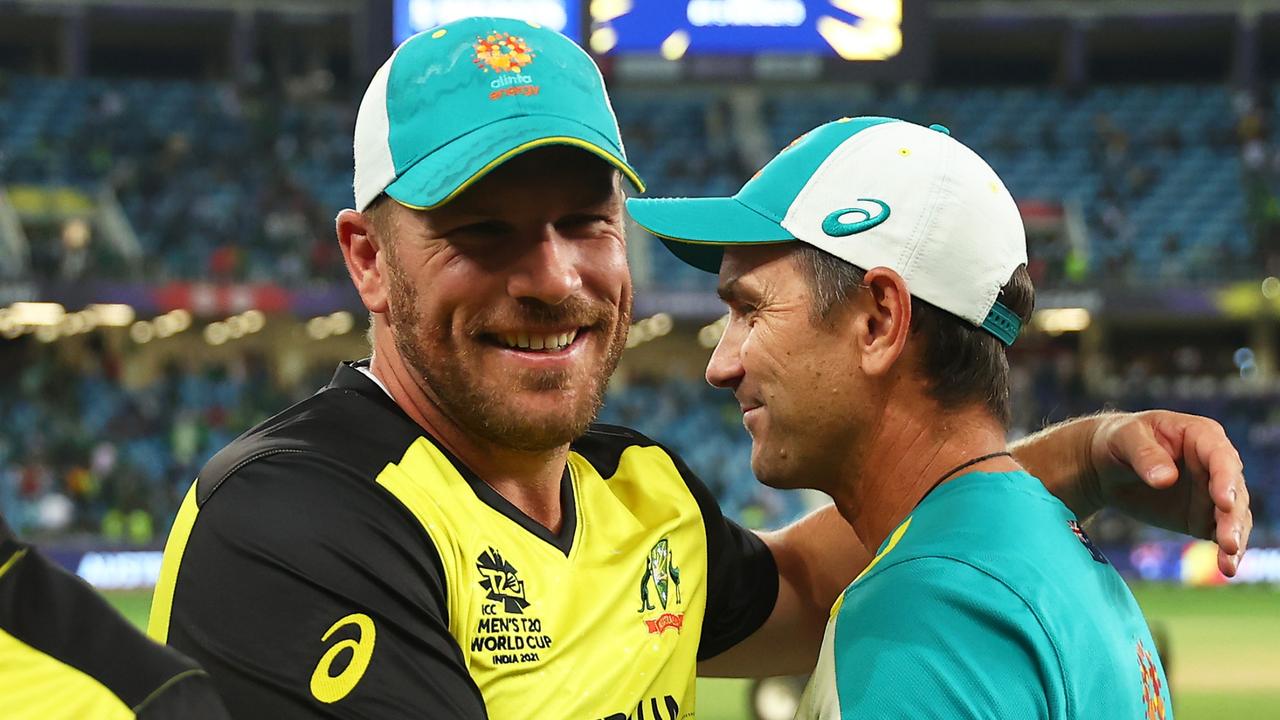 Aaron Finch of Australia and Justin Langer celebrate the T20 World Cup win (Photo by Michael Steele-ICC/ICC via Getty Images)