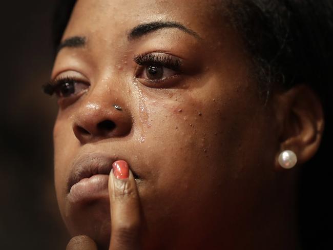 A church goer cries during a service at the Potter's House, in Dallas, that included a memorial to the five police officerS killed last week as well as a town hall meeting discuss recent police shootings. Picture: AP/Eric Gay