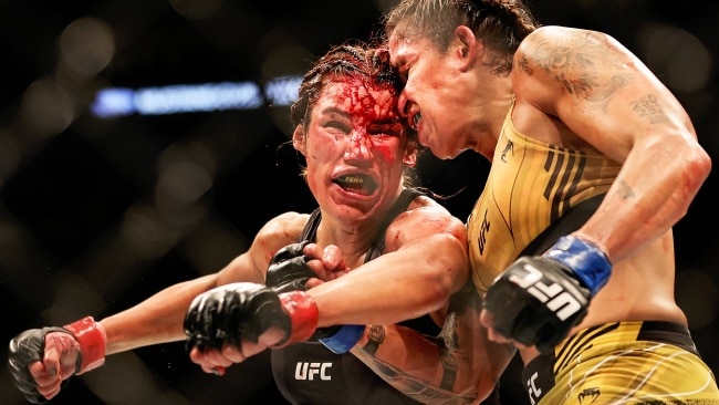 DALLAS, TEXAS - JULY 30: Amanda Nunes of Brazil exchanges strikes with Julianna Pena in their bantamweight title bout during UFC 277 at American Airlines Center on July 30, 2022 in Dallas, Texas. (Photo by Carmen Mandato/Getty Images)