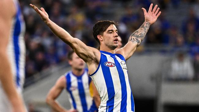 PERTH, AUSTRALIA - JUNE 08: Jy Simpkin of the Kangaroos celebrates a goal during the 2024 AFL Round 12 match between the West Coast Eagles and the North Melbourne Kangaroos at Optus Stadium on June 08, 2024 in Perth, Australia. (Photo by Daniel Carson/AFL Photos via Getty Images)