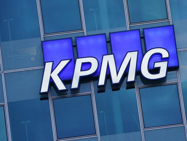 BERLIN, GERMANY - JANUARY 22: The logo of KPMG, a multinational tax advisory and accounting services company, hangs on the facade of a KPMG offices building on January 22, 2021 in Berlin, Germany. KPMG has come under the spotlight in Germany due to the company's role in the current Wirecard scandal.  (Photo by Sean Gallup/Getty Images)