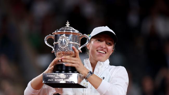 Swiatek celebrates with the trophy after winning the French Open final against Coco Gauff. Picture: Getty