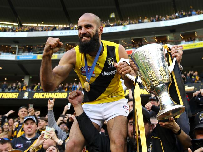 MELBOURNE, AUSTRALIA - SEPTEMBER 30:  Bachar Houli of the Tigers celebrates with fans after winning the 2017 AFL Grand Final match between the Adelaide Crows and the Richmond Tigers at Melbourne Cricket Ground on September 30, 2017 in Melbourne, Australia.  (Photo by Cameron Spencer/AFL Media/Getty Images)
