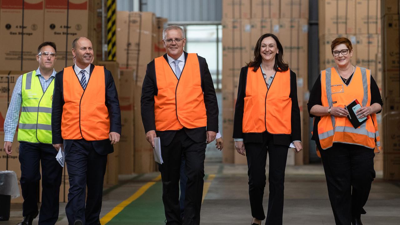 Prime Minister Scott Morrison visits Rheem with Josh Frydenberg (second from left), Senator Marise Payne (far right) and Maria Kovacic, Liberal Candidate for Parramatta (second from right). Picture: Jason Edwards