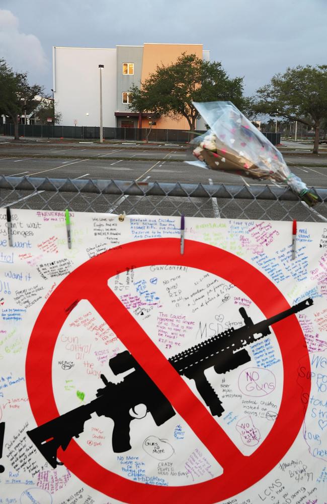 A sign is seen on the fence around Marjory Stoneman Douglas High School in front of the freshman dorm where a mass shooting took place. Picture: AFP