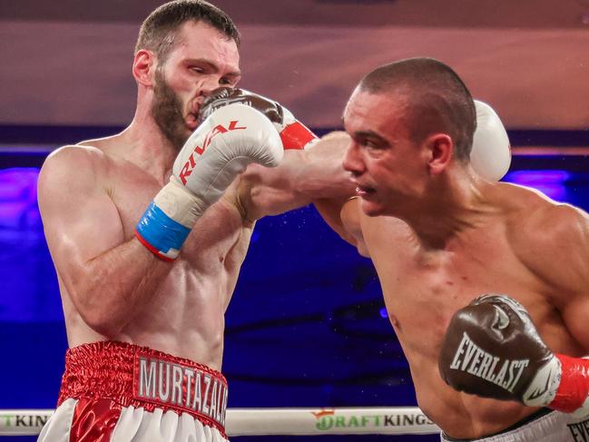 ORLANDO, FLORIDA - OCTOBER 19: Tim Tszyu punches Bakhram Murtazaliev in the nose at Caribe Royale Orlando on October 19, 2024 in Orlando, Florida. (Photo by Alex Menendez/Getty Images)