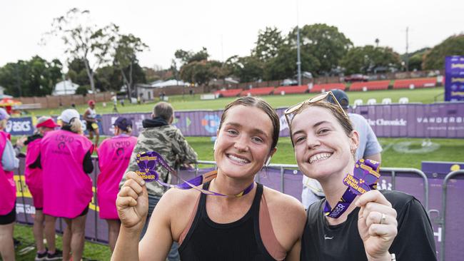 Sisters Grace Bennett (left) and Maddi Blades proudly show their 10km finishers medal at the Toowoomba Marathon event, Sunday, May 5, 2024. Picture: Kevin Farmer