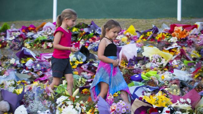 Mourners attend a candlelight vigil outside Dreamworld in 2016. (Photo by Glenn Hunt/Getty Images)