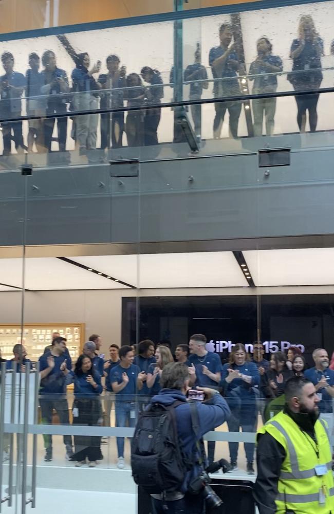 Apple employees getting ready to welcome customers. Picture: Jack Evans