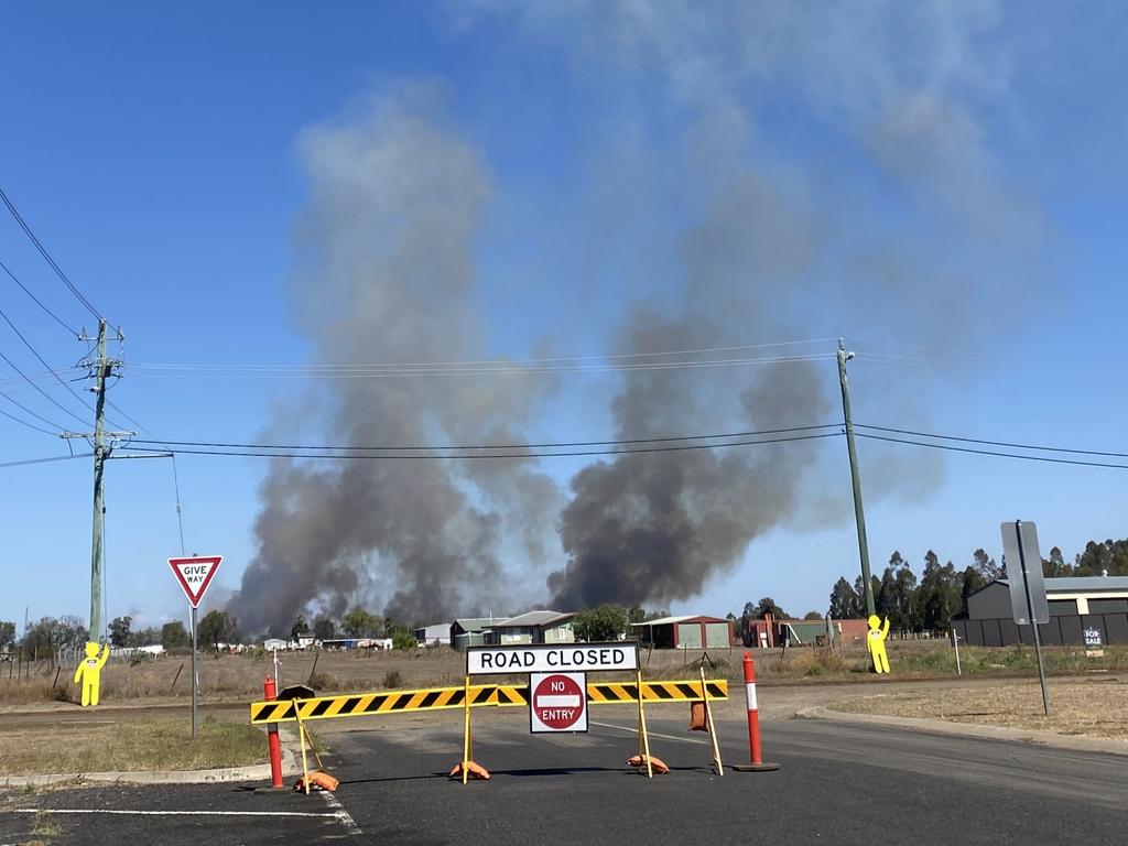 A large grass fire is threatening homes on the eastern side of Dalby, near the intersection of the Warrego Highway and Dalby-Cecil Plains Road.