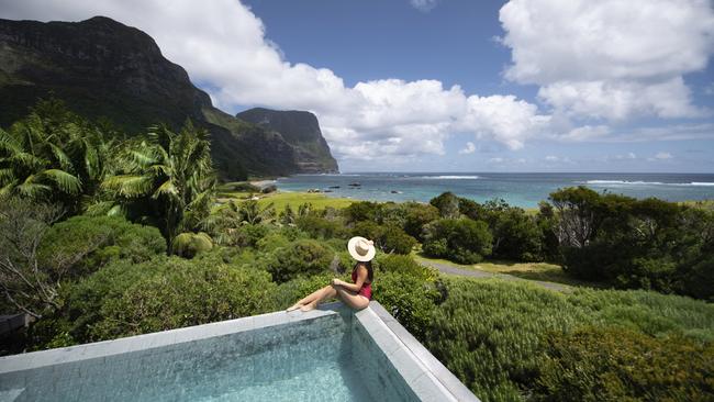 Woman relaxing by the pool at Capella Lodge, Lord Howe Island. Picture: tom-archer.com