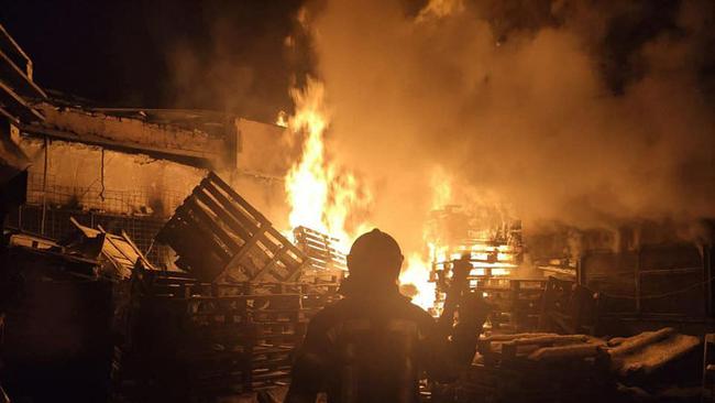 Firefighters putting out a large-scale fire at a food warehouse in Severodonetsk, Lugansk region, destroyed following Russian shelling. Picture: AFP.