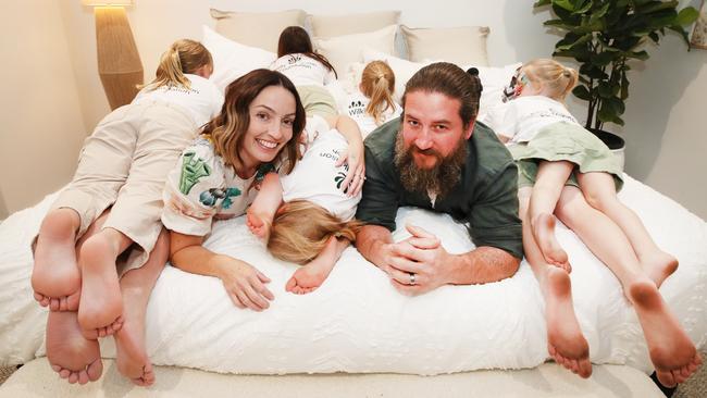 Danielle and Rhys Carroll with the children at their new home on the Gold Coast. Picture: Glenn Hampson.