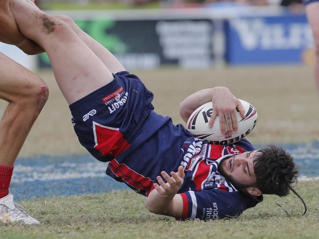 Max Murphy of Runaway Bay Sea Eagles is tackles. Photo: Regi Varghese