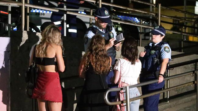 The man’s friends talk to police after he went missing. Picture: Bill Hearne