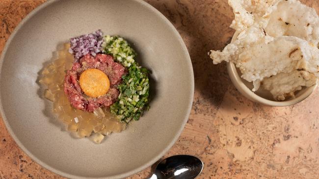 Beef tartare with pho jelly and anchovy tapioca crisps. Picture: Tony Gough.