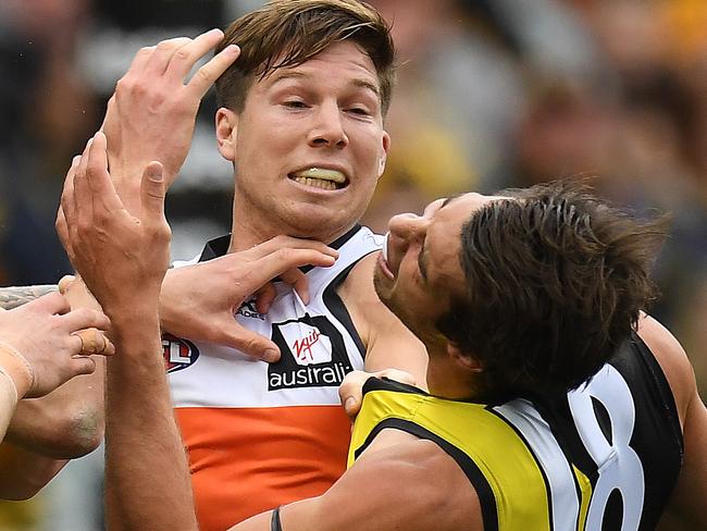 Toby Greene (left) of the Giants and Alex Rance of the Tigers wrestle during the Round 18 AFL match between the Richmond Tigers and the Greater Western Sydney Giants at the MCG in Melbourne, Sunday, July 23, 2017. (AAP Image/Julian Smith) NO ARCHIVING, EDITORIAL USE ONLY
