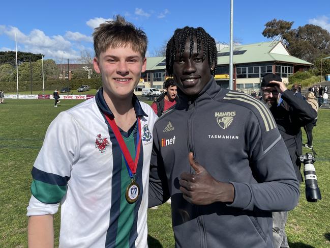 Herald Sun Shield intermediate final best on ground St Patrick's Ned Renfree with Hawthorn footballer Changkuoth Jiath. Picture: Max Hatzoglou