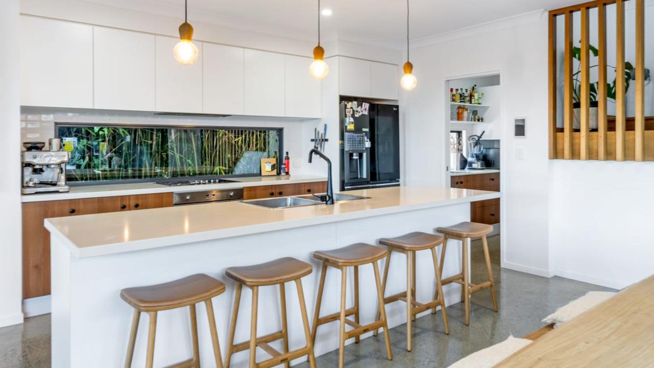 The kitchen has a butler’s pantry and stone benchtop