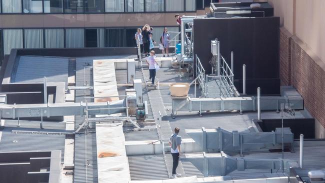 School kids climb the building. Picture: Jason Edwards