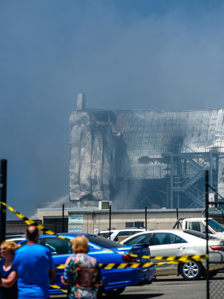 Emergency services continue to work on the huge fire at the Thomas Foods abattoir in Murray Bridge the morning after it broke out. Picture: AAP / Roy Vandervegt