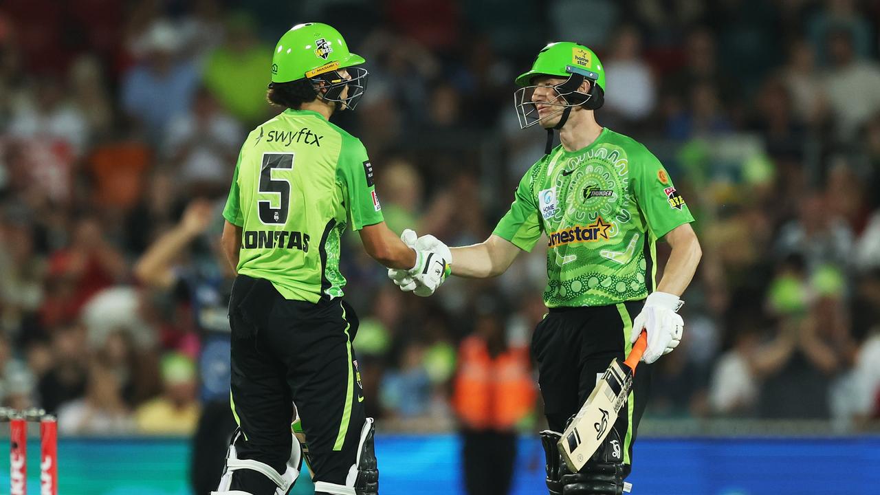 Cameron Bancroft congratulates Konstas on his half-century. (Photo by Mark Metcalfe/Getty Images)