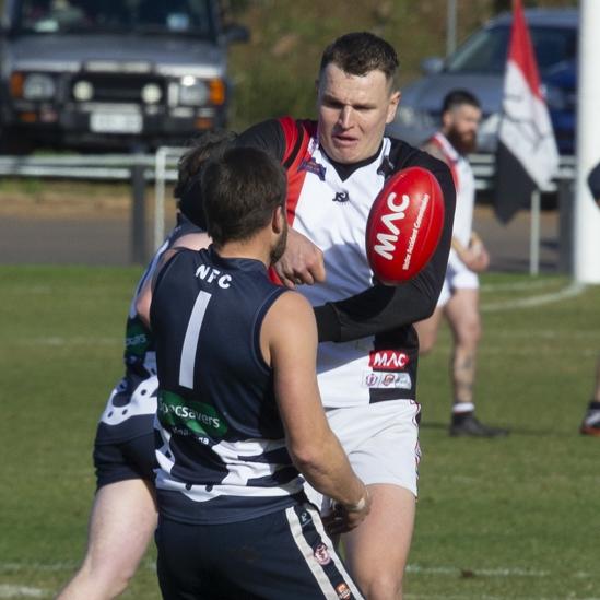 Christies Beach forward Daniel Nobes takes on Noarlunga during the SFL's round one. Picture: James Baker Photography