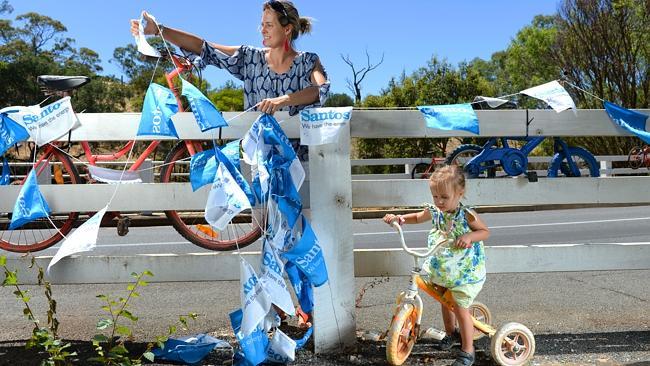 Sarah Barret with daughter Georgie, 2, gets Angaston ready for the first stage of the Tour Down Under. Picture: Naomi Jellico...