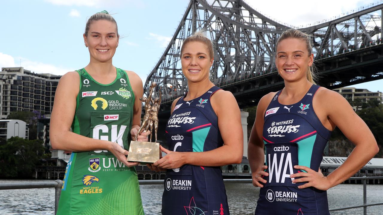 West Coast Fever captain Courtney Bruce and Melbourne Vixens co-captains Kate Moloney and Liz Watson with the Super Netball trophy. Picture: Jono Searle/Getty Images