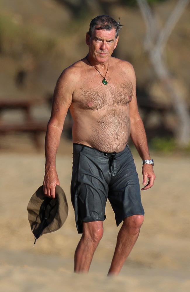 Actor Pierce Brosnan hits the beach.