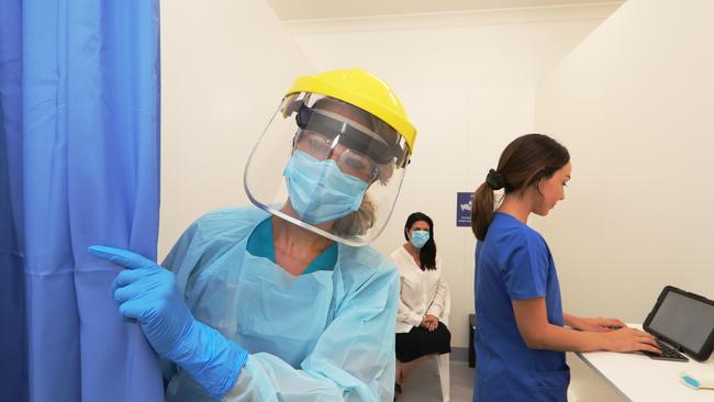 Burleigh Cove Respiratory Clinic registered nurse Angel Anderson in her PPE at the centre. Picture Glenn Hampson