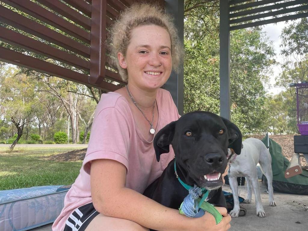 Ebony-Rose Daly and her dog Nora are camping in swags at the Hinkler Lion's Park.