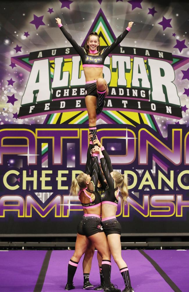 Cheerleader Maddy Holmes 16 lifted by fellow cheerleaders from Mega Cheer for the opening. Picture Glenn Hampson