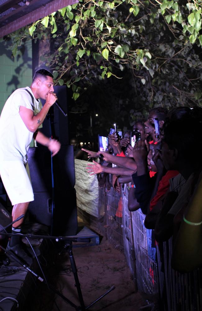 Fans watch Darwin-born rapper J-MILLA perform live in Wadeye on June 1, 2023 while the concert is streamed live on TikTok. Picture: Jason Walls