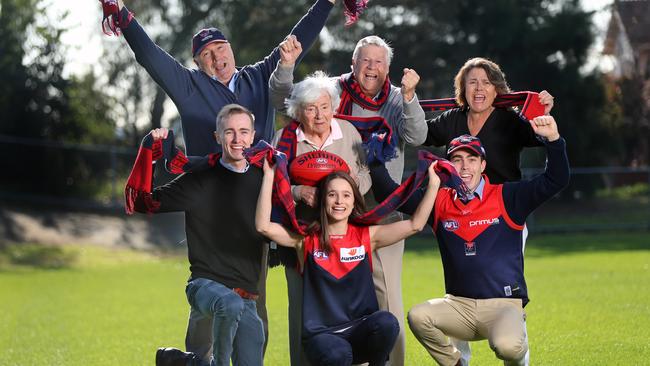 Demons fans Michael Ramsden, Max Day, Cathy Ramsden, (front row) and James Hockings, Caroline Ramsden and James Ramsden (back row) with Bette Day in the middle. Picture: Alex Coppel