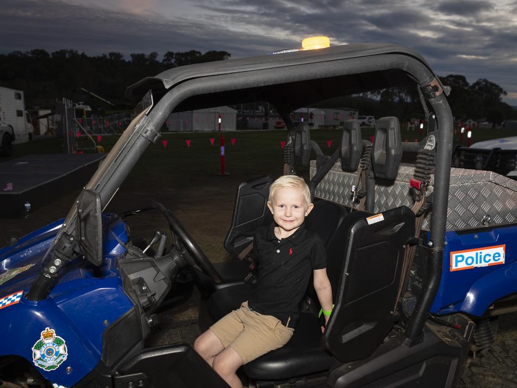 Four-year-old George Jessen sits in a police buggy at the Toowoomba Royal Show, Friday, March 31, 2023. Picture: Kevin Farmer