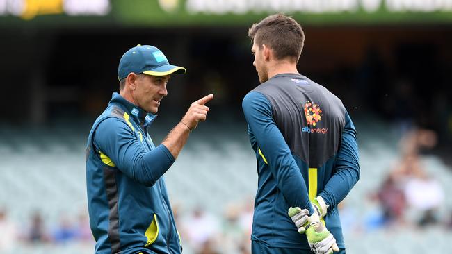 Australian coach Justin Langer (left) gestures to captain Tim Paine at the Adelaide Oval in 2018. Picture: AAP/Dave Hunt