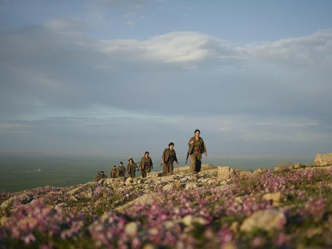 Kurdistan Workers' Party (PKK) guerillas patrol the countryside in Makhmour, Iraq