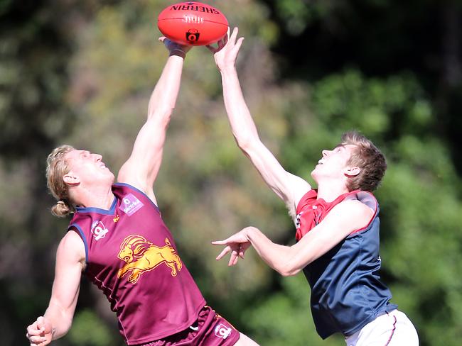 Round 6 QAFL game between reigning premiers Palm Beach Currumbin Lions and Surfers Paradise Demons at Salk Oval. Photo of Jonathan Croad (PBC) and Harris Newton. Gold Coast 11th May, 2019 AAP Image/Richard Gosling