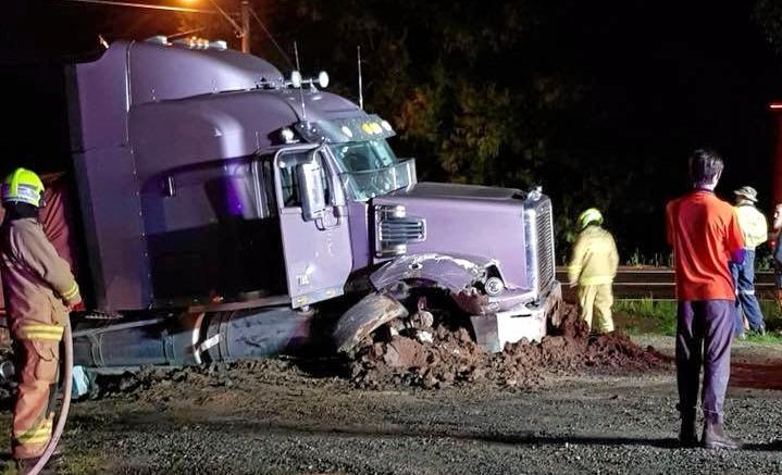 Two trucks collided at Ulmarra late Tuesday night with one hitting a muddy embankment. Picture: John Leask