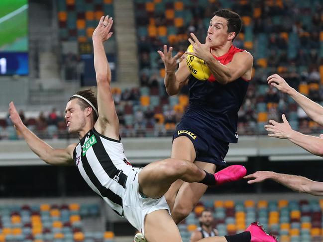 AFL Round 12....15/08/2020.... Melbourne vs Collingwood at the Gabba, Brisbane.  Sam Weideman of the Demons flies over Darcy Moore of the Magpies but dropped the mark Q1  . Pic: Michael Klein